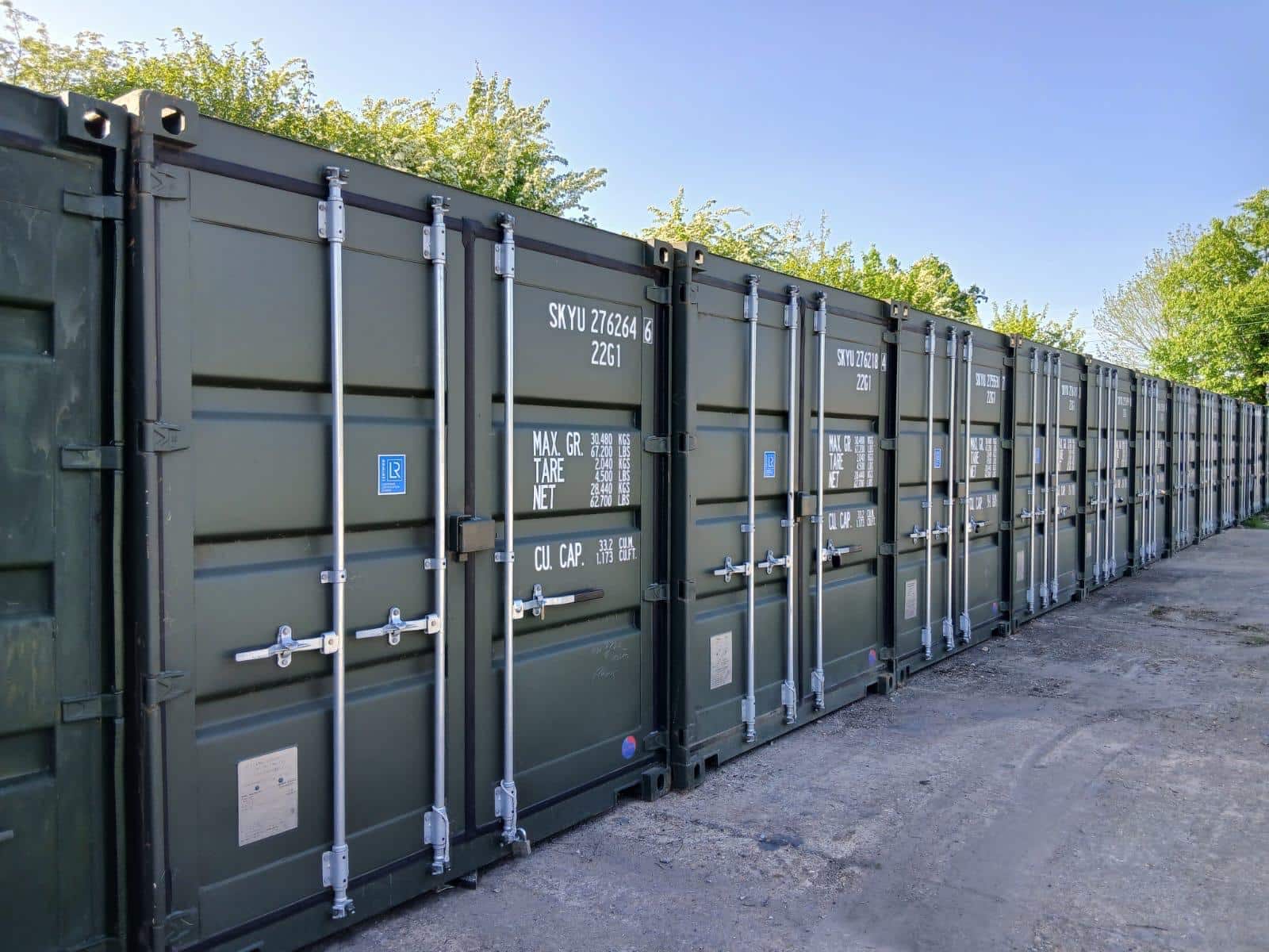 Row of green 20ft storage containers at Paddock Wood Self Storage in Kent